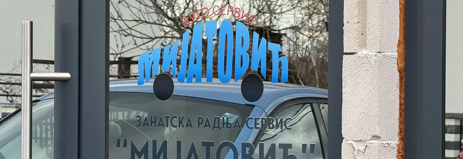 The Mijatović car-service logo as lettering on a shop window